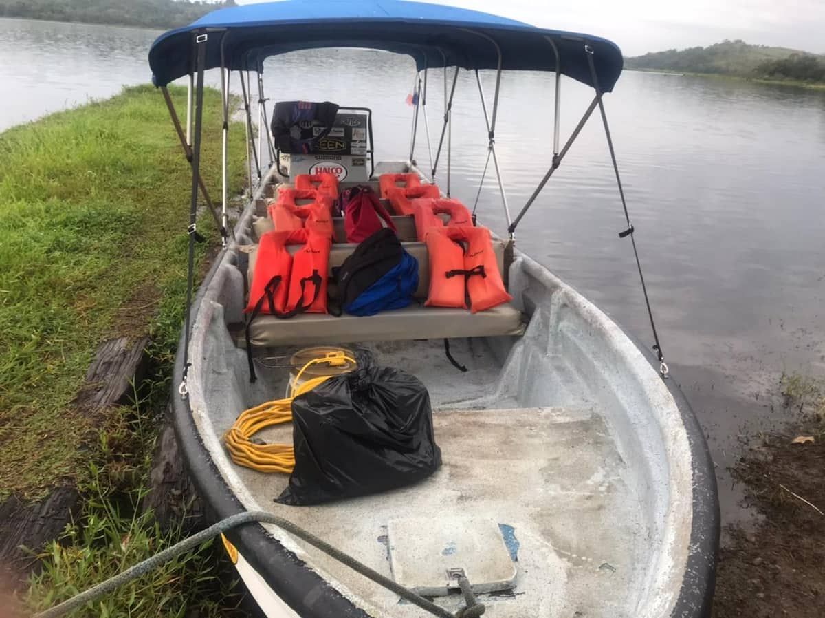 Fishing boat with life jackets and gear docked at Gatun Lake, Panama City, ready for a wildlife adventure tour.