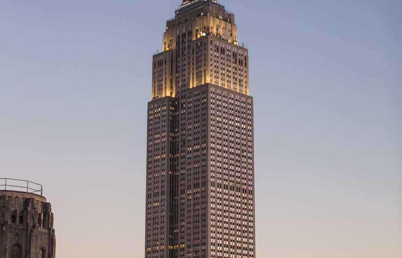 Towering Bank of America Building at dusk, illuminated against a twilight sky in Panama City, Panama.