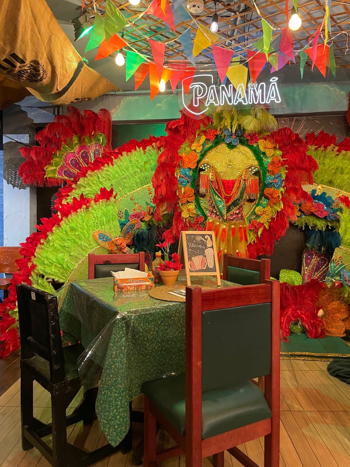 Vibrant Guna cultural display featuring colorful feathered costumes and festive decorations at Bandits Adventure Tours Panama's Urban Tour in Casco Viejo, Panama City.