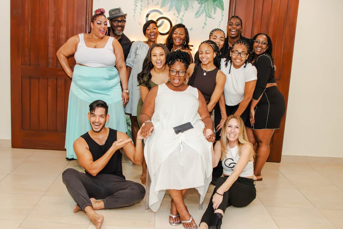 A group of people smiling and posing together during a salsa dance lesson in Panama City, Panama.