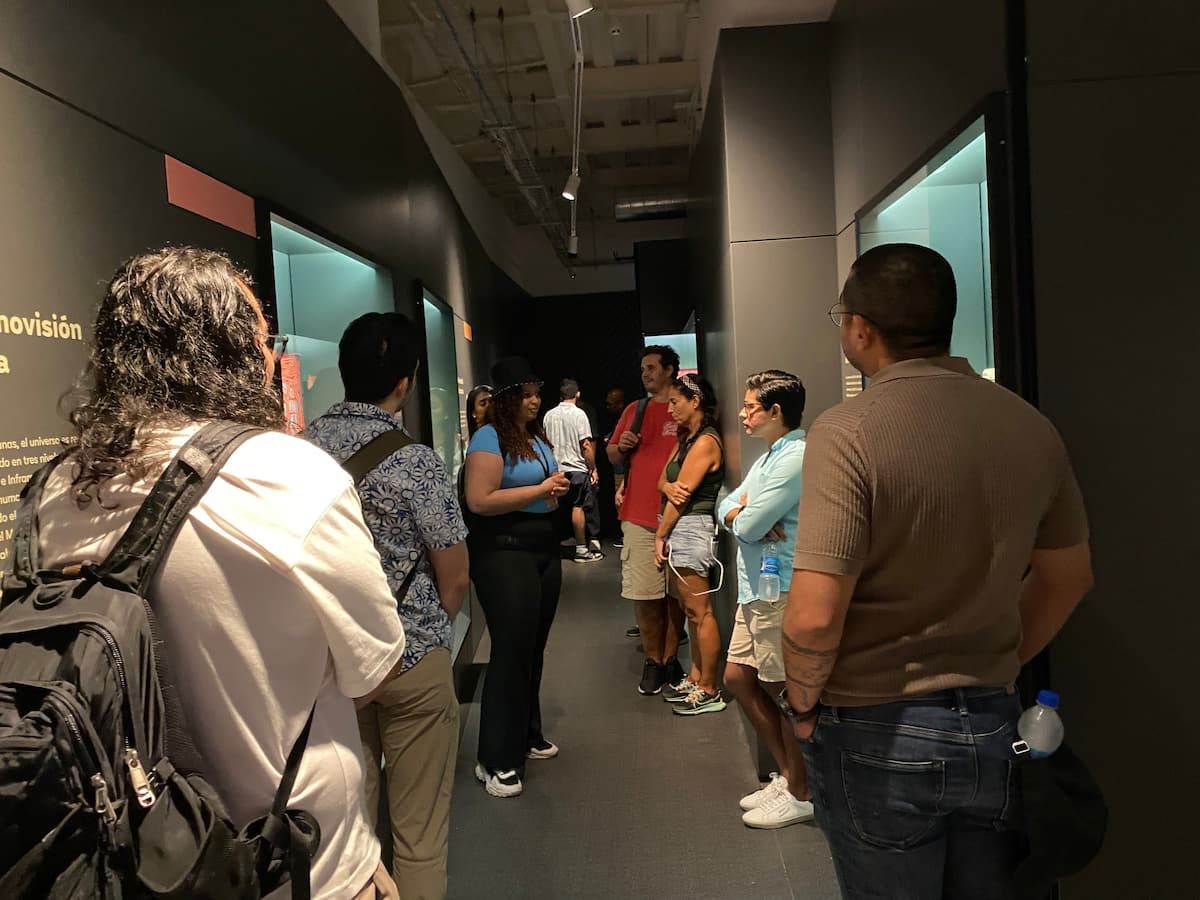 Tourists exploring a museum exhibit during the Old Town Streets History Casco Viejo tour in Panama City, Panama.