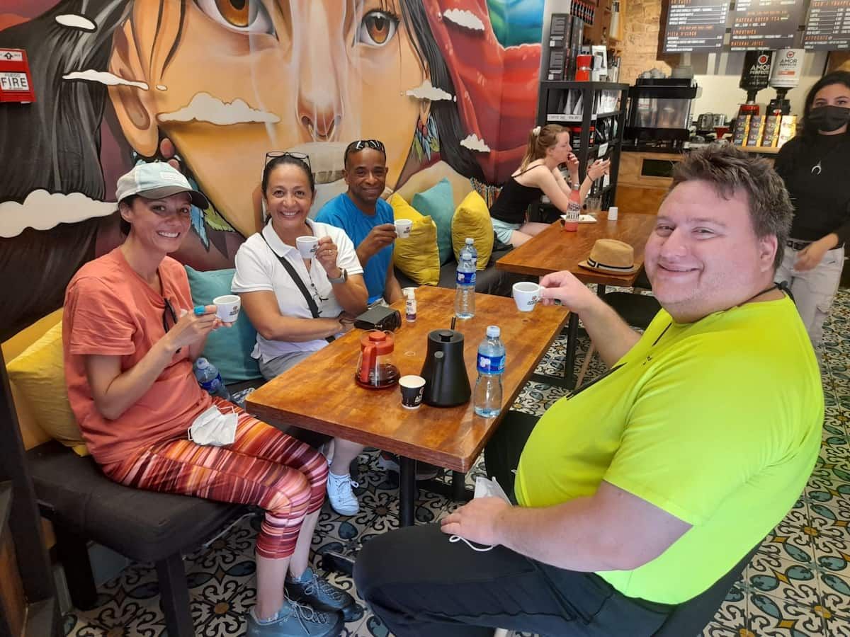 Tourists enjoying coffee at a vibrant cafe during the Panama Canal Locks Casco Viejo Tour in Panama City, Panama.