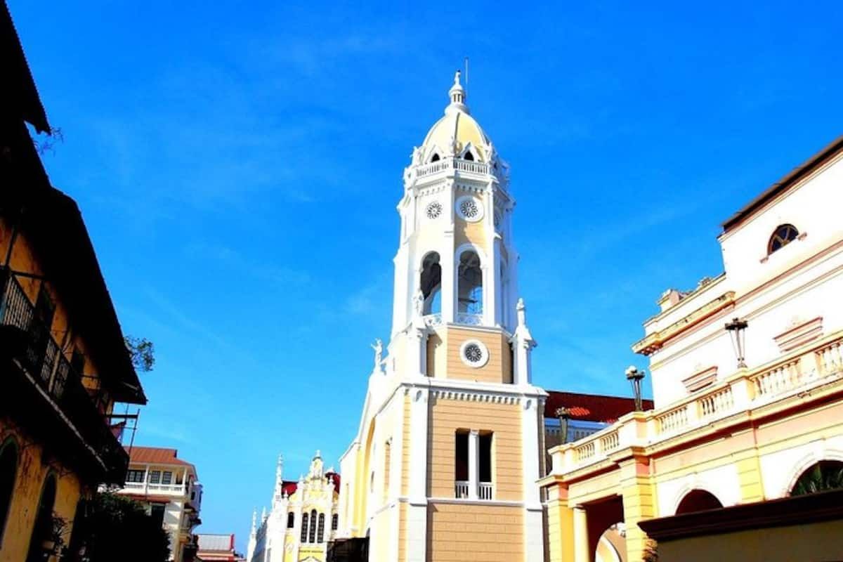 Cathedral of Panama City with its ornate clock tower and colonial architecture under a clear blue sky, located in the historic Casco Viejo district.