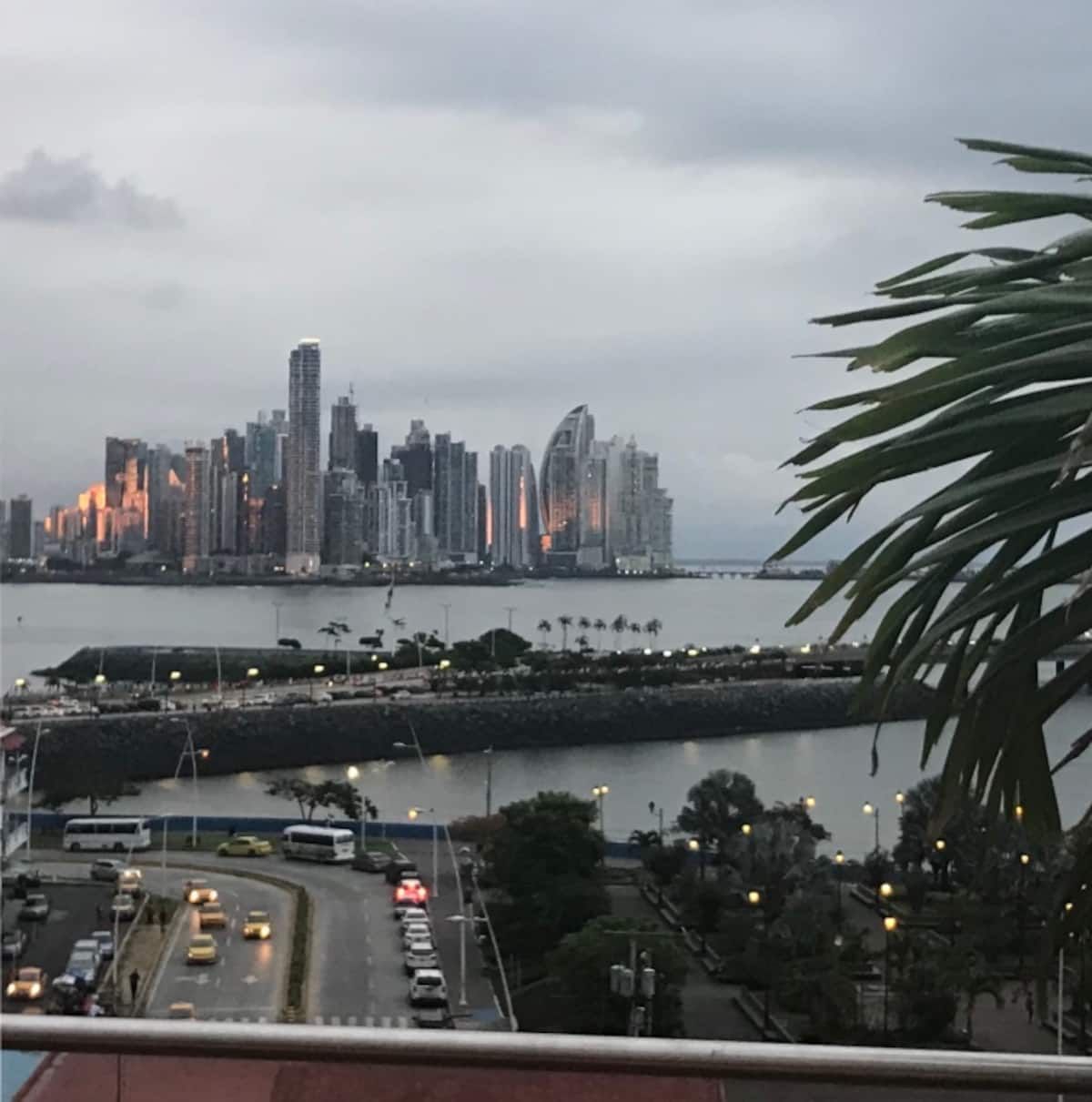 Dusk view of Panama City skyline with waterfront promenade and traffic, showcasing the urban landscape for Salsa Reel Custom Choreography tour