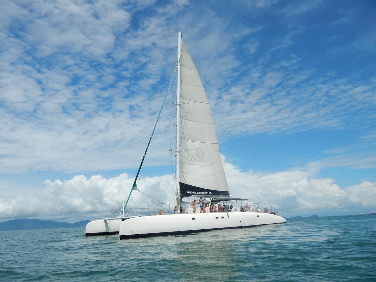 Catamaran sailing on turquoise waters under a bright blue sky during the Taboga Island Tour in Panama City, Panama