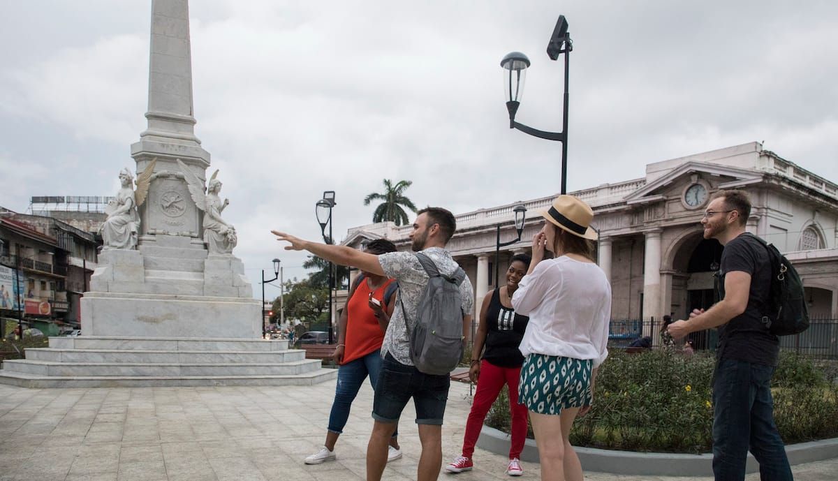 Tourists on a guided exploration of Panama City's historical monument and colonial architecture, capturing the essence of local culture and culinary delights.